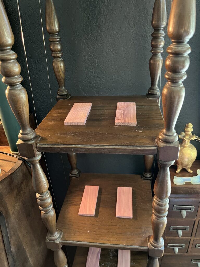 Two cedar planks rest on each shelf